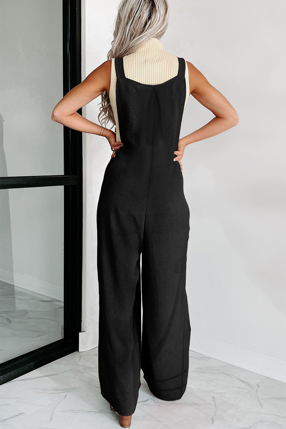 Chic Wide-Leg Jumpsuit with Button Straps