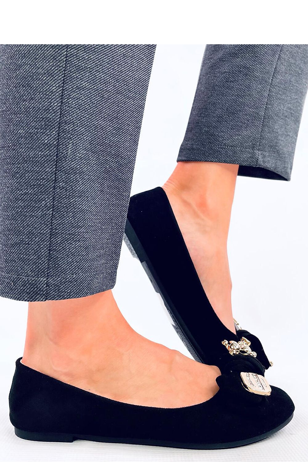 A Bow with a gold safety pin and teddy bear Ballet flats