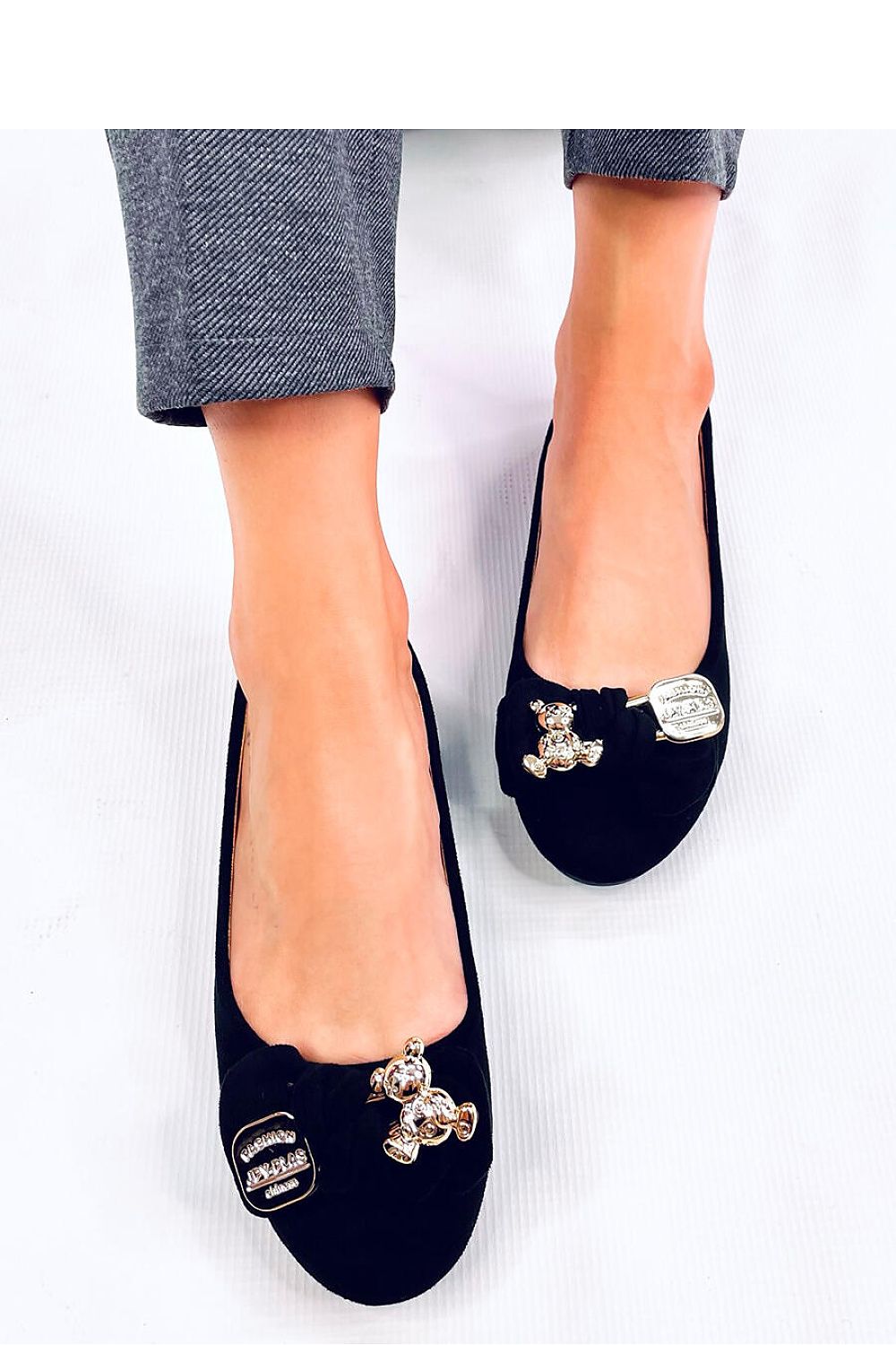 A Bow with a gold safety pin and teddy bear Ballet flats
