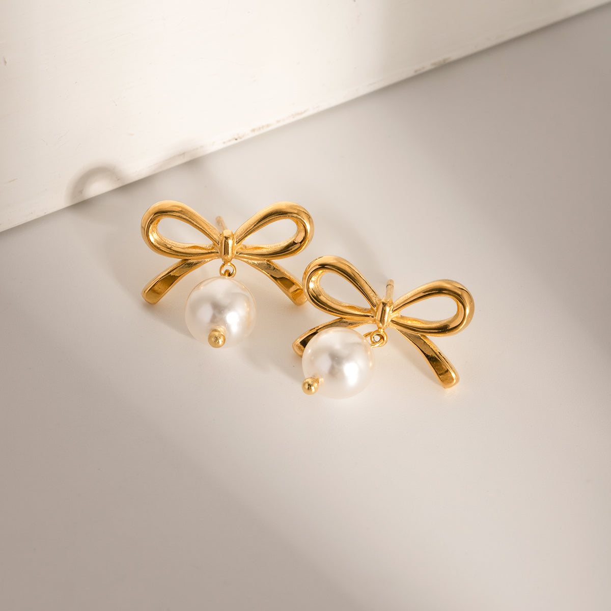Stainless Steel Gold Bow Pearl Earrings